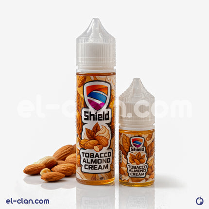قنينة فيب ليكويد Shield e-juice بنكهة توباكو لوز كريمة، عبوة واضحة مع تصميم أنيق وزجاجة مميزة.