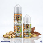 سائل فيب ليكويد نكهة توباكو الفسدق من XO E-Liquid، زجاجة صغيرة مع عبوة التبغ والفستق على خلفية بيضاء